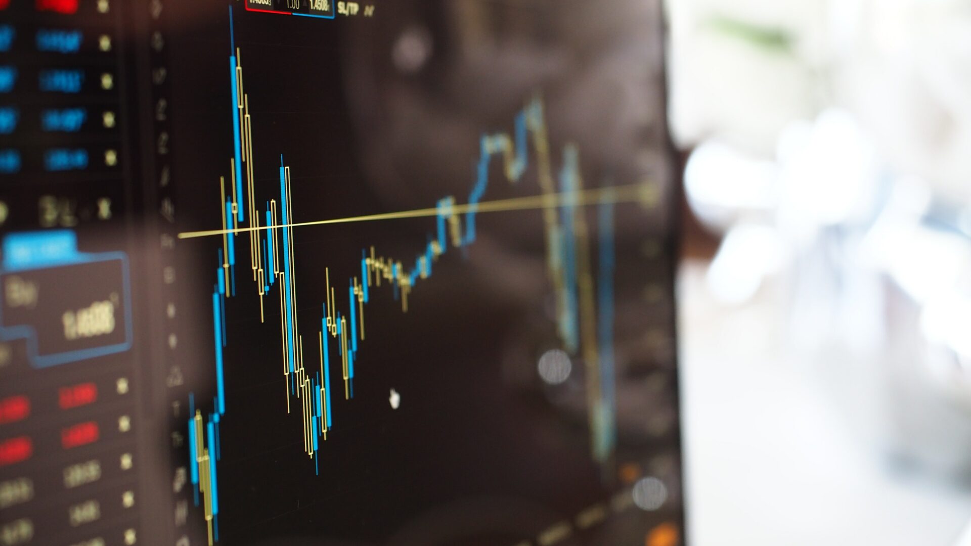 Change Finance - - Blue and yellow graph on stock market monitor