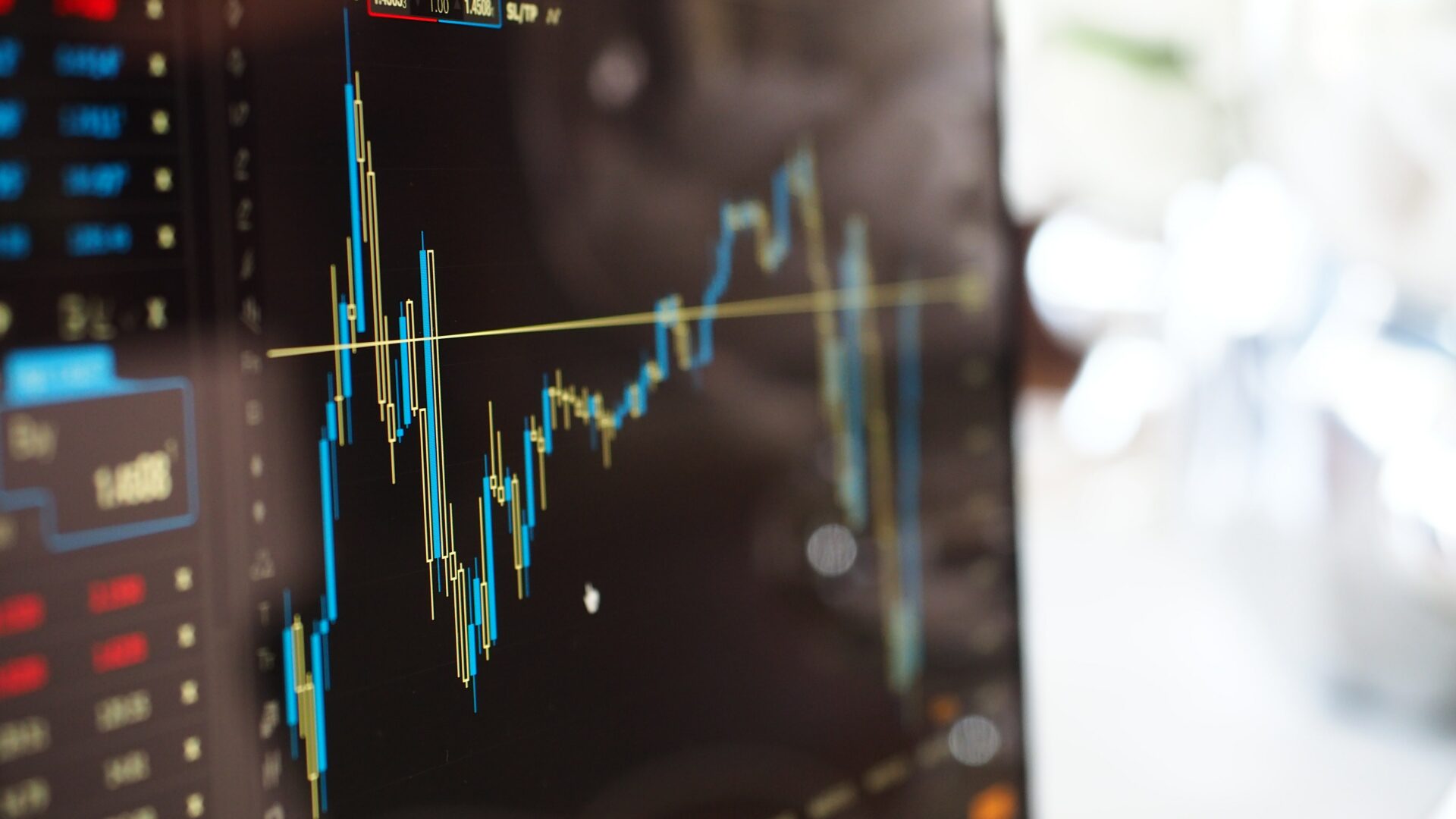 Change Finance -  - Blue and yellow graph on stock market monitor